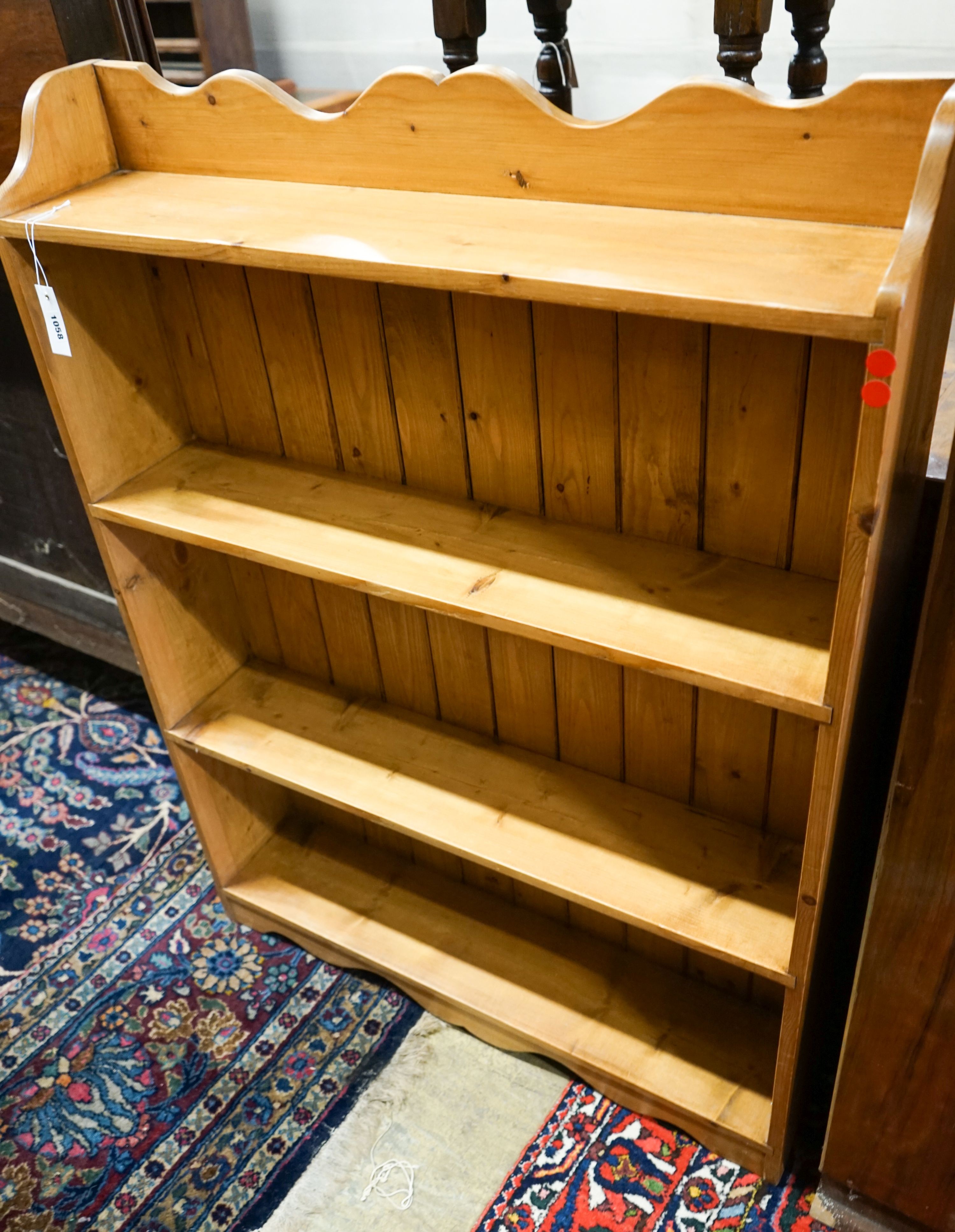 A Victorian style stripped pine open bookcase, width 89cm, depth 20cm, height 120cm